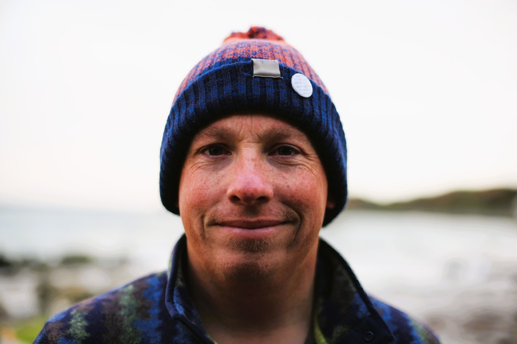 Image of ben smiling wearing a bobble hat